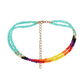 A vibrant beaded bracelet with a gold chain, displaying a mix of colors and elegant craftsmanship.